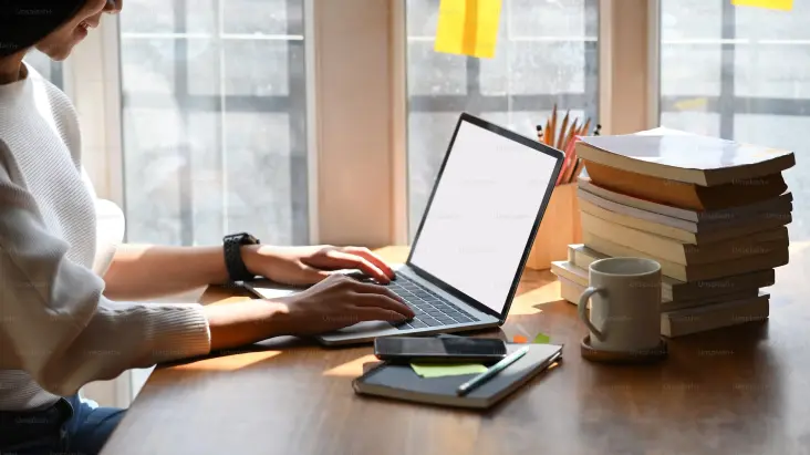 Author setting up his website on the laptop