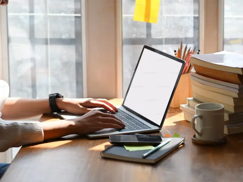 Author setting up his website on the laptop